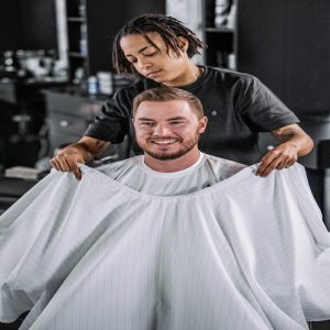 Barber Strong The Barber Cape White W black Pinstripe